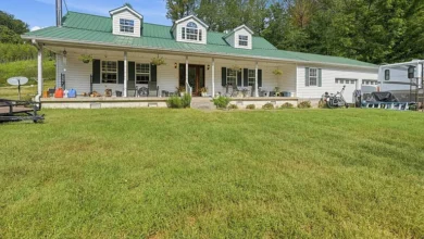 Country Home with a Stone Fireplace, Barn and 15 Acres in Minor Hill, Tennessee — 9,900